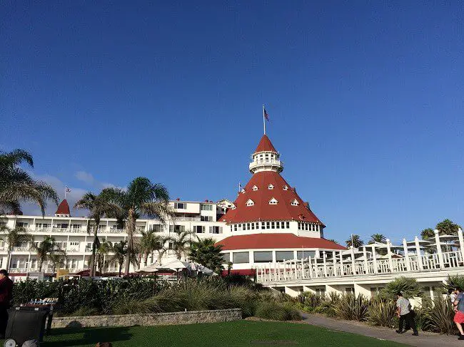 Hotel del Coronado with palm trees and relaxing grounds for a great San Diego staycation