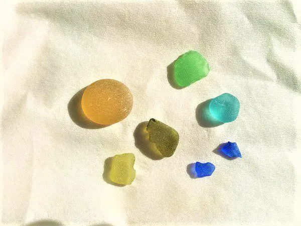 Rare sea glass pieces on white background from sea glass collected in San Diego