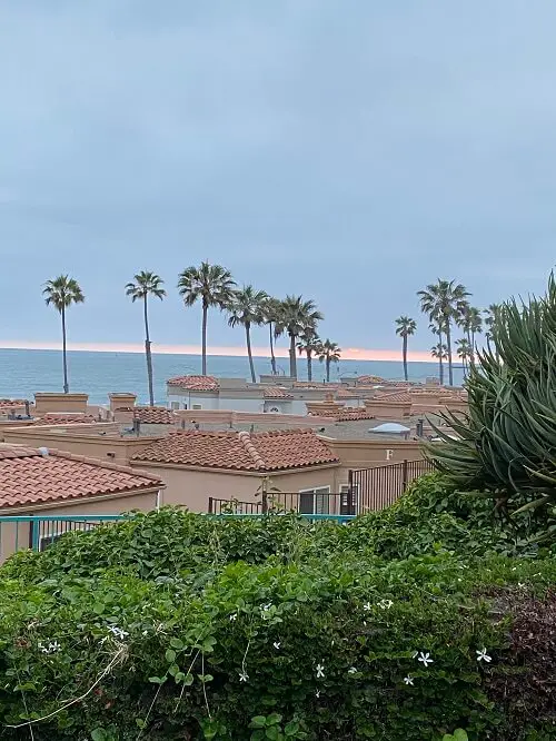San Diego summer day in oceanside with ocean view over red tile rooftops.